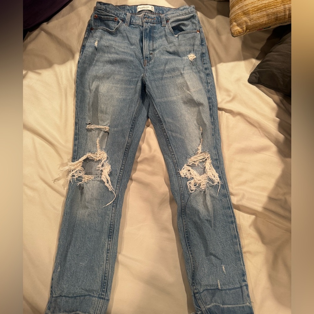 High rise mom jeans with rips and distressed bottoms